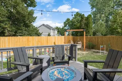 a patio with two chairs and a table at Artist Getaway In Downtown Westminster in Westminster