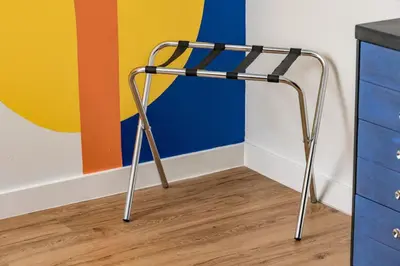 a metal chair in a room with a colorful wall at The MCM Movie Manor With A Big Backyard And A Movie Theater in Arvada