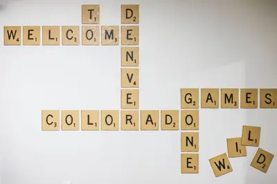 a wooden cross with the words welcome and announcements at Games Gone Wild Between Red Rocks And Downtown Denver In Arvada in Arvada