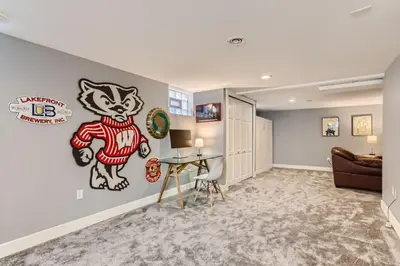 a living room with a cat mural on the wall at Highlands Bungalow With A Back Yard And A Fire Pit in Denver