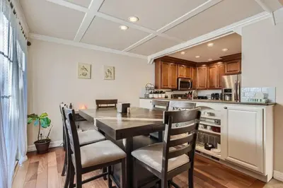 a kitchen with a dining room table and chairs at Pet Friendly Townhome WIth A Fireplace And A King Bed In Littleton in Littleton