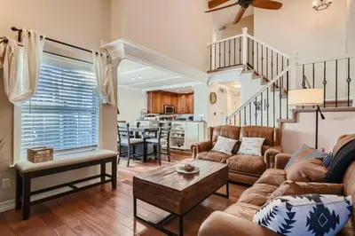 a living room with a couch and a table at Pet Friendly Townhome WIth A Fireplace And A King Bed In Littleton in Littleton