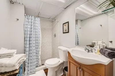 a bathroom with a sink and a toilet and a shower at Pet Friendly Townhome WIth A Fireplace And A King Bed In Littleton in Littleton