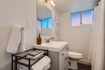 a white bathroom with a sink and a toilet at Sleeps 10 And Pet Friendly Home In Denver Near Red Rocks in Denver