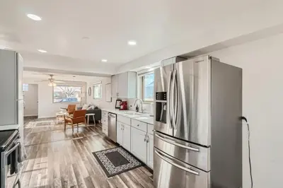 a kitchen with a stainless steel refrigerator at Sleeps 10 And Pet Friendly Home In Denver Near Red Rocks in Denver