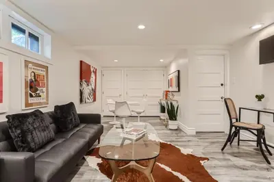 a living room with a couch and a table at Guest Suite At Hilltop And Cherry Creek Near to Museums in Denver