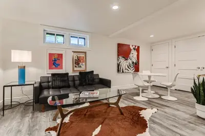 a living room with a couch and a table at Guest Suite At Hilltop And Cherry Creek Near to Museums in Denver