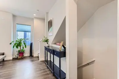 a hallway with a blue dresser in a house at 3 Bedrooms 2 Bath Townhome In West Denver Near to Red Rocks And Foothills in Lakewood