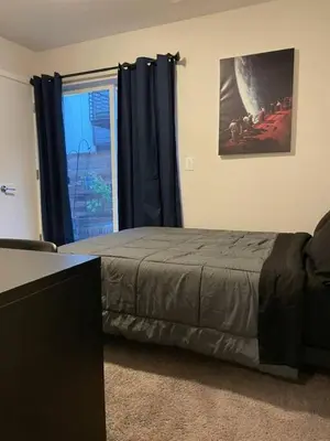 a bedroom with a bed and a window at 3 Bedrooms 2 Bath Townhome In West Denver Near to Red Rocks And Foothills in Lakewood