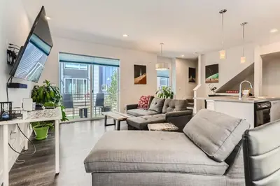 a living room with a couch and a table at 3 Bedrooms 2 Bath Townhome In West Denver Near to Red Rocks And Foothills in Lakewood