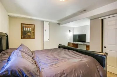 a bedroom with a bed in a room at Near to DIA Airport retreat And 20 Min To Downtown Denver in Henderson