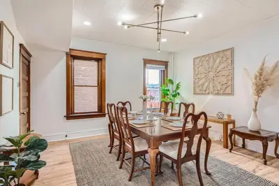 a dining room with a table and chairs at Remodeled 3 Bedroom Close to St Broadway And Sante Fe And CBD in Denver