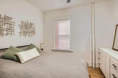 a bedroom with a bed and a window at Remodeled 3 Bedroom Close to St Broadway And Sante Fe And CBD in Denver