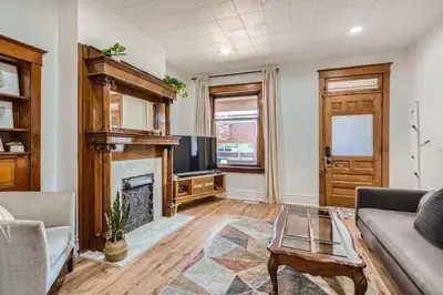 a living room with a fireplace and a tv at Remodeled 3 Bedroom Close to St Broadway And Sante Fe And CBD in Denver