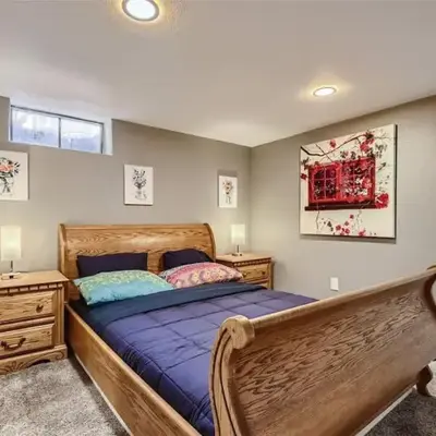 Basement Guest Suite With A Pool Table A Hot Tub And A TV