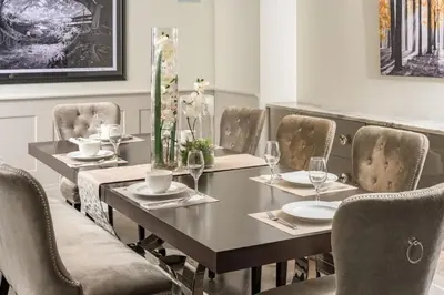 a dining room with a table and chairs at Ultra Luxury Loft With A Fireplace In The Rooftop In RiNo in Denver