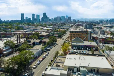 an aerial view of a city with a city skyline at Ultra Luxury Loft With A Fireplace In The Rooftop In RiNo in Denver