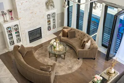 a living room with a couch and a table at Ultra Luxury Loft With A Fireplace In The Rooftop In RiNo in Denver