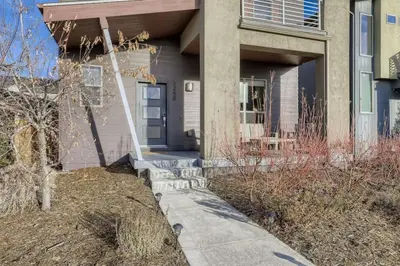 a house with a front door and a sidewalk at New Central Park Home Near DIA And 20mins to Downtown in Denver