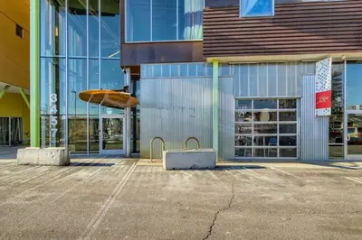 a building with a surfboard on display in front of it at New Hip Loft Near RiNo Taxi District With A Pool in Denver