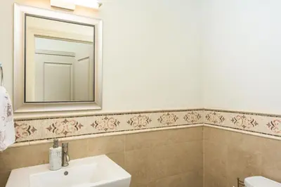 a bathroom with a sink and a mirror at RiNo Loft With Parking And Mountain Views in Denver