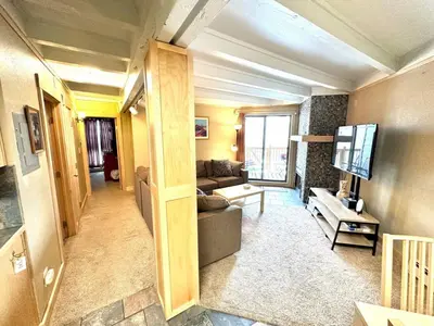 a living room with a couch and a tv at Pet Friendly With A Fireplace A Pool Near Mountain Biking And Skiing in Silverthorne