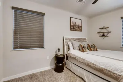 a bedroom with a bed and a window at Pet Friendly In West Denver Bungalow Near Meow Wolf in Denver