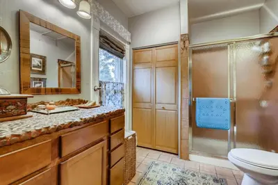 a bathroom with a shower and a toilet and a sink at Artsy Victorian Great Location And Amazing Outdoor Space in Denver