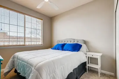 a bedroom with a large bed and a window at Capital Hill Condo 5 star location With Balcony in Denver