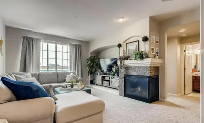 a living room with a couch and a fireplace at Capital Hill Condo 5 star location With Balcony in Denver