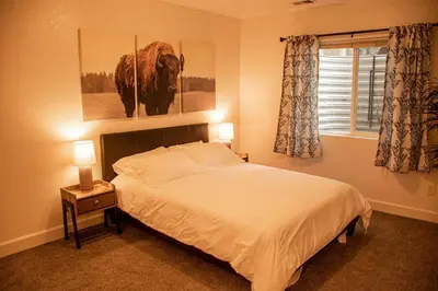 a bedroom with a large bed and a window at Spacious Oasis near Red Rocks and Downtown Denver in Lakewood