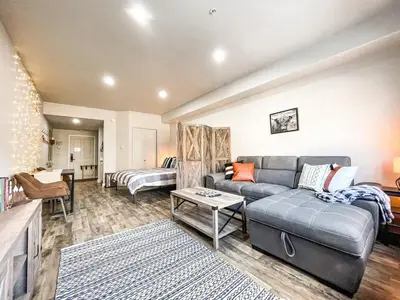 a living room with a couch and a bed at Cozy Mountain Suite - hot tub, pool, gym - mins to lift in Keystone