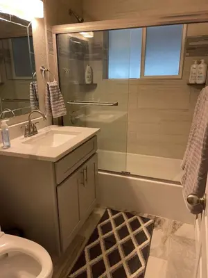 a bathroom with a shower and a sink and a toilet at Island in the City - AWESOME 3 BR 2 BA 15 Min from DIA DT Anschutz in Commerce City
