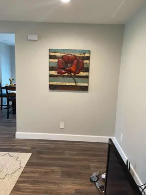 a painting of a red bird on a wall at Island in the City - AWESOME 3 BR 2 BA 15 Min from DIA DT Anschutz in Commerce City