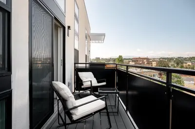 two chairs on a balcony with a view at 2880 U505 Skytop Perspective at Espadin in Denver