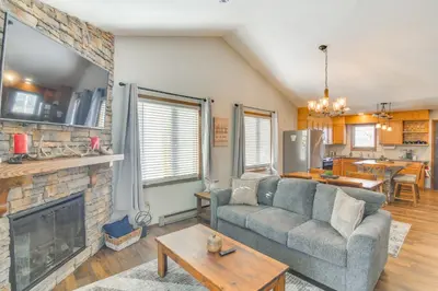 a living room with a couch and a fireplace at Family-Friendly Retreat with Balcony in Fraser! in Fraser
