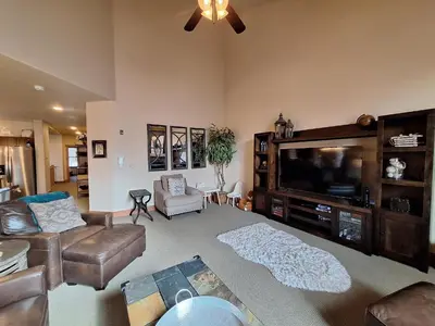 a living room with a couch and a television at 3BR Red Hawk Townhome - Gondola Access townhouse in Keystone