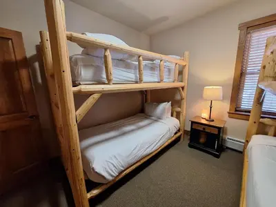 a bedroom with two bunk beds in a room at 3BR Red Hawk Townhome - Gondola Access townhouse in Keystone