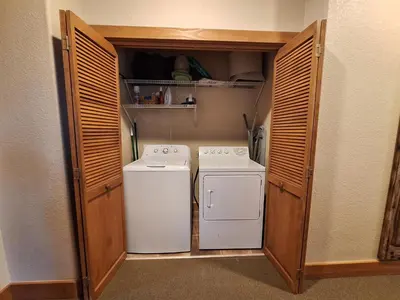 a small laundry room with a washer and dryer at 3BR Red Hawk Townhome - Gondola Access townhouse in Keystone
