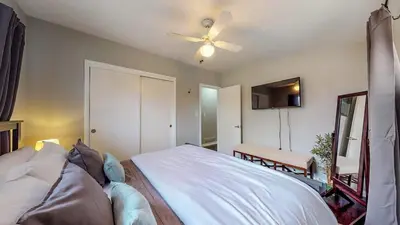 a bedroom with a bed and a ceiling fan at Charming Three Bedroom Home in Littleton in Littleton