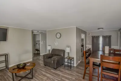 a living room with a couch and a table at Spacious ranch on large lot near water world in Federal Heights