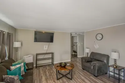 a living room with a couch and a table at Spacious ranch on large lot near water world in Federal Heights
