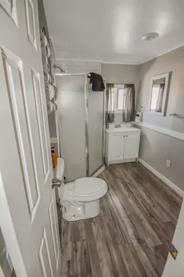 a bathroom with a toilet and a shower at Spacious ranch on large lot near water world in Federal Heights