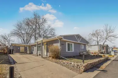 a house on a street with a driveway at Spacious ranch on large lot near water world in Federal Heights