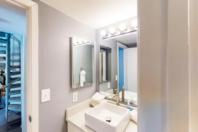 a bathroom with a sink and a mirror at Flying Dutchman - Snow Owl Condo in Keystone