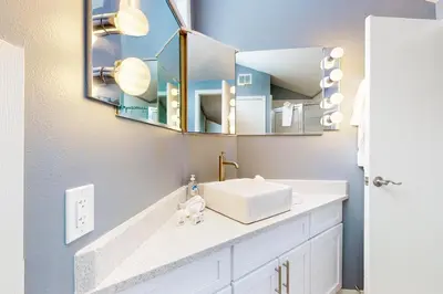 a bathroom with a sink and a mirror at Flying Dutchman - Snow Owl Condo in Keystone