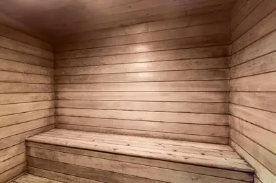 a wooden sauna with a bench in it at Flying Dutchman - Snow Owl Condo in Keystone