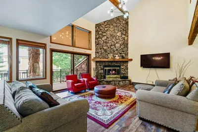 a living room with two couches and a fireplace at Spacious Keystone Family Escape Great Location in Keystone