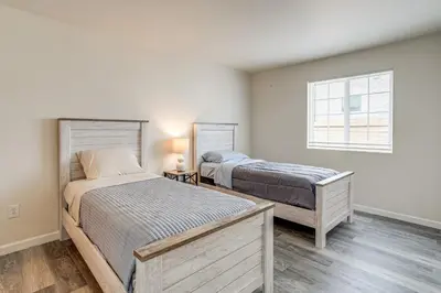 a bedroom with two beds and a window at 5 Mi to Cherry Creek State Park Cozy Family Home! in Aurora