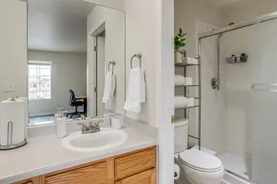 a bathroom with a sink and a toilet at 5 Mi to Cherry Creek State Park Cozy Family Home! in Aurora